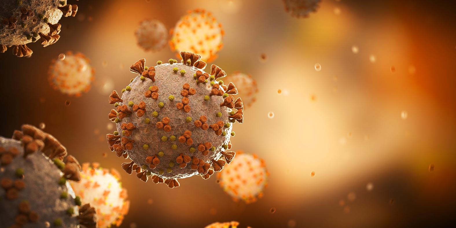 Microscopic view of COVID virus on orange-gold background