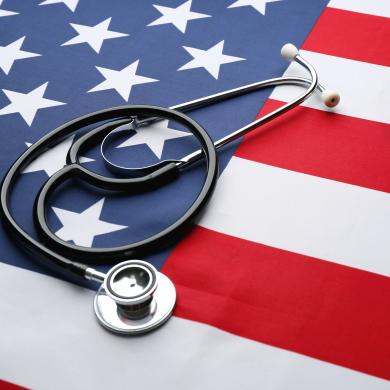 a stethoscope laying on top of the American flag