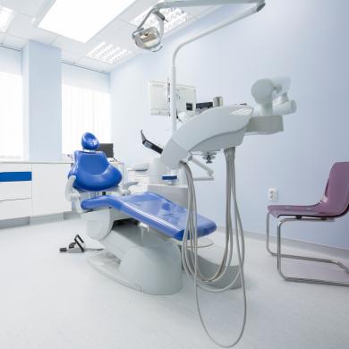 dental clinic room with chair and tools