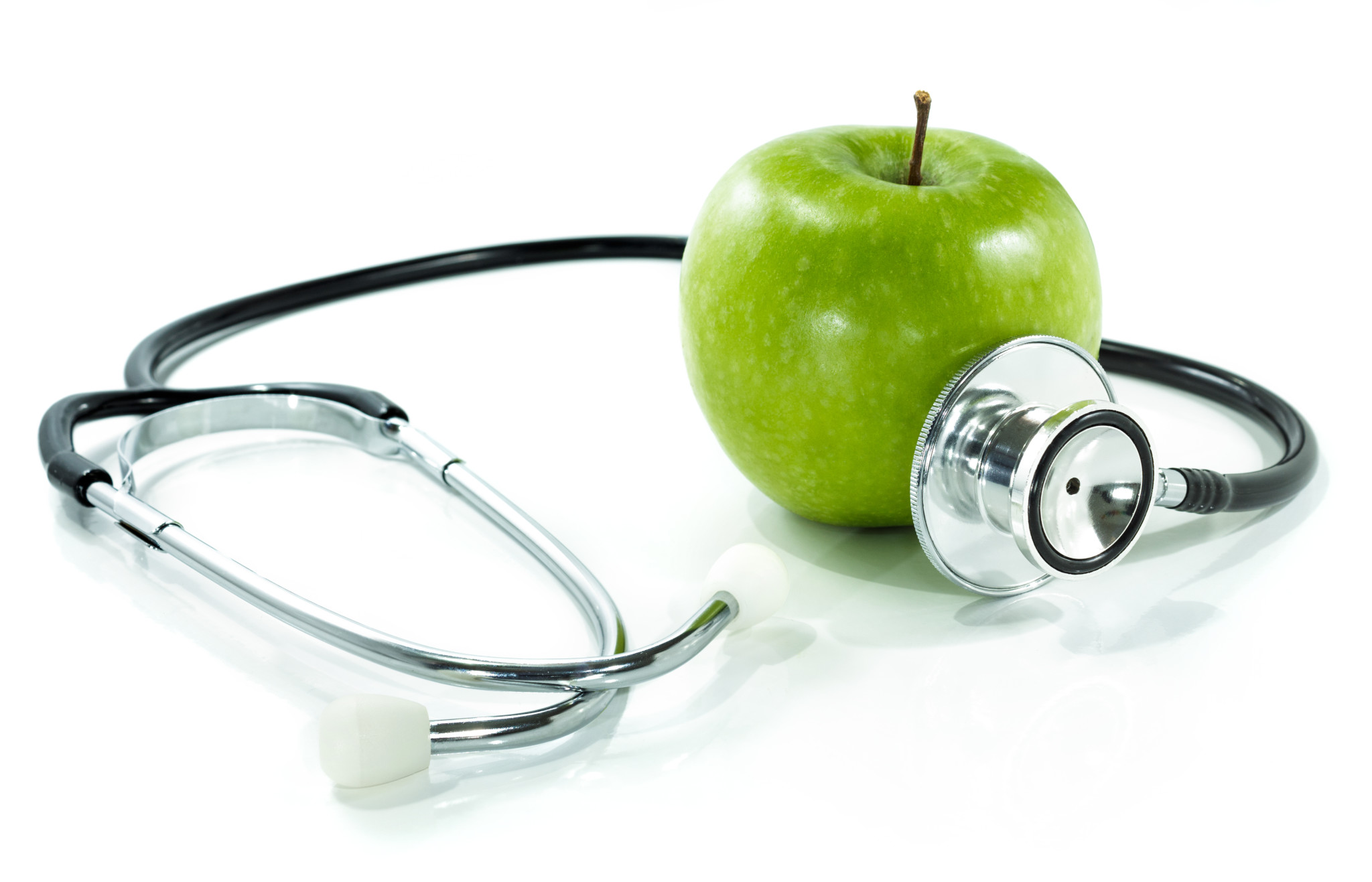 Stethoscope wrapped around an apple