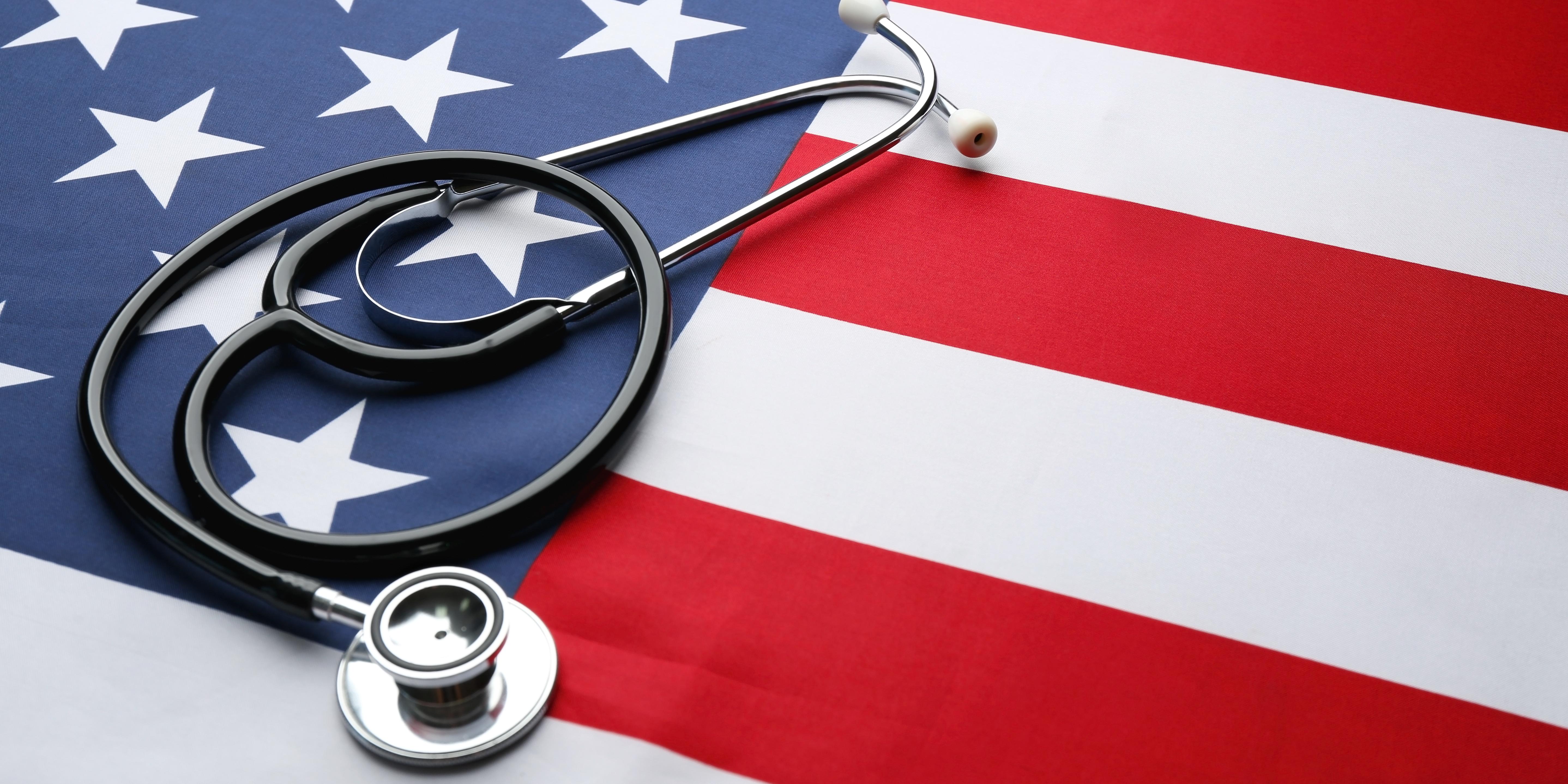a stethoscope laying on top of the American flag